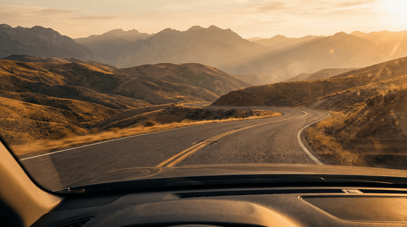 Scenic mountain landscape with winding road and blue sky